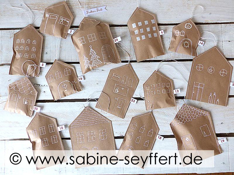 Weihnachtsgeschenke mit Kindern selber machen: 5 zauberhafte Ideen 7 DIY Adventskalender selber machen, Haeuser aus Packpapier selber machen, Geschenk zu Weihnachten selber machen
